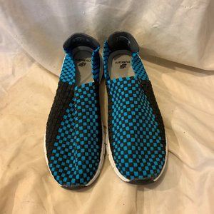 Pair of Makani beach shoes. Lack and Blue checkered.